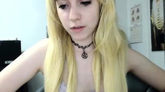 Blonde teen in solo action with her pussy