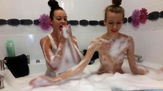 Hotties playing with each other in bath tub